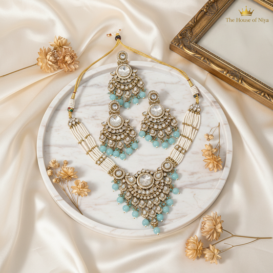 Mint aqua polki necklace, chandbali earrings and tikka set on marble tray